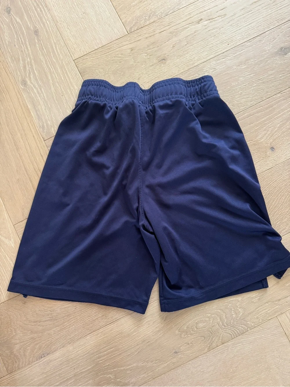 2 pairs of Under Armour Boy's Performance Shorts - 1 black/ 1 navy blue- youth m